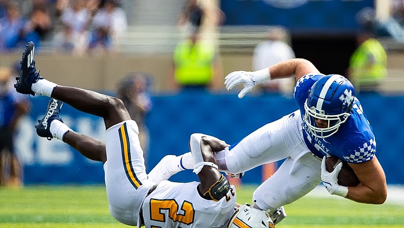 Sep 18, 2021; Lexington, Kentucky, USA; Kentucky Wildcats tight end Brenden Bates (80) is tackled by Chattanooga Mocs defensive back Jerrell Lawson (27) during the second quarter at Kroger Field. Mandatory Credit: Jordan Prather-USA TODAY Sports