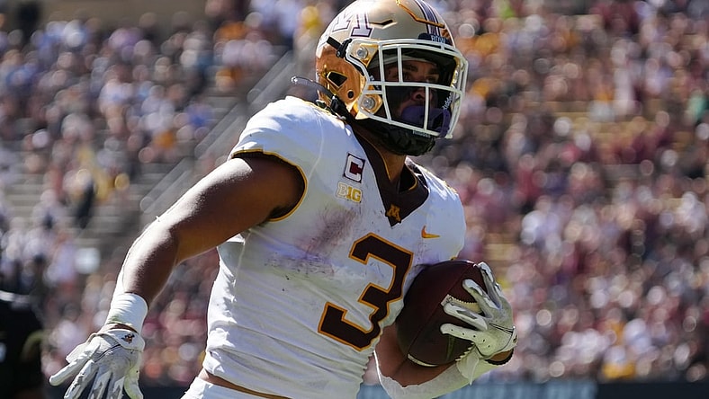 Sep 18, 2021; Boulder, Colorado, USA; Minnesota Golden Gophers running back Treyson Potts (3) carries for a touchdown in the first quarter at Folsom Field. Mandatory Credit: Ron Chenoy-USA TODAY Sports
