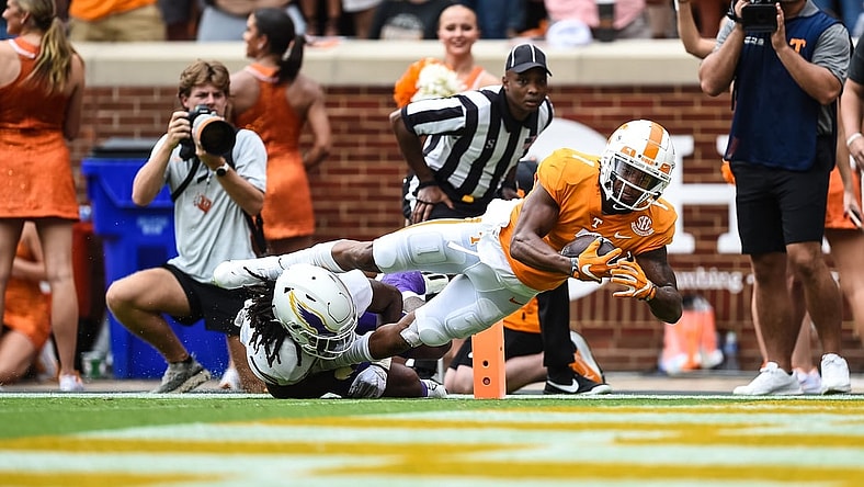Sep 18, 2021; Knoxville, Tennessee, USA; Tennessee Volunteers wide receiver Velus Jones Jr. (1) dives over Tennessee Tech Golden Eagles defensive back Jamaal Boyd (8) for a touchdown during the first half at Neyland Stadium. Mandatory Credit: Bryan Lynn-USA TODAY Sports