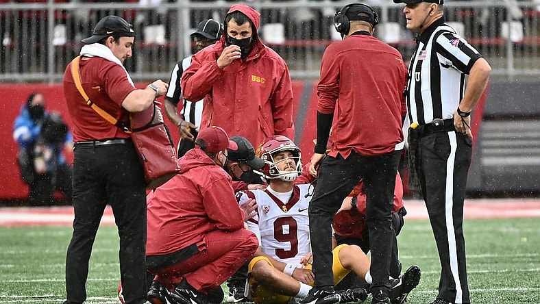 Sep 18, 2021; Pullman, Washington, USA; USC Trojans quarterback Kedon Slovis (9) is checked out by medical staff during a game against the Washington State Cougars in the first half at Gesa Field at Martin Stadium. Mandatory Credit: James Snook-USA TODAY Sports