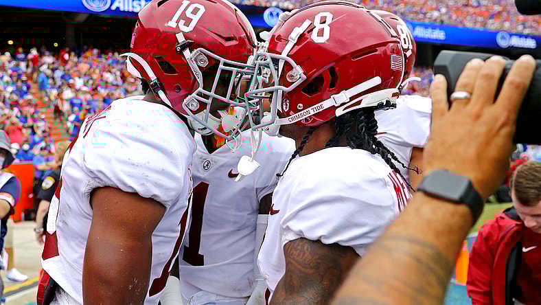 Sep 18, 2021; Gainesville, Florida, USA; Alabama Crimson Tide tight end Jahleel Billingsley (19) celebrates with wide receiver John Metchie III (8) after scoring a touchdown during the first quarter against the Florida Gators celebrates at Ben Hill Griffin Stadium. Mandatory Credit: Mark J. Rebilas-USA TODAY Sports