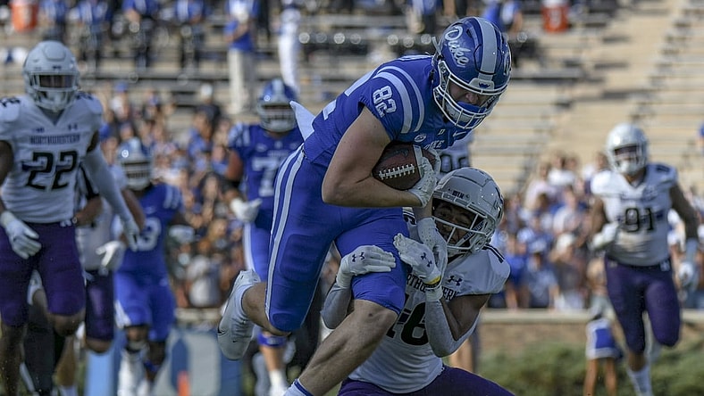 Sep 18, 2021; Durham, North Carolina, USA; Duke Blue Devils tight end Cole Finney (82) is tackled by Northwestern Wildcats safety Brandon Joseph (16) during the second quarter at Wallace Wade Stadium. Mandatory Credit: William Howard-USA TODAY Sports
