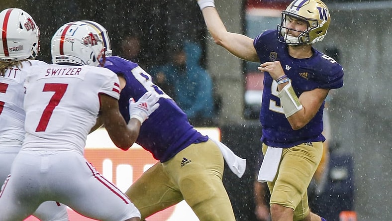 Sep 18, 2021; Seattle, Washington, USA; Washington Huskies quarterback Dylan Morris (9) throws a pass against the Arkansas State Red Wolves during the second quarter at Alaska Airlines Field at Husky Stadium. Mandatory Credit: Joe Nicholson-USA TODAY Sports