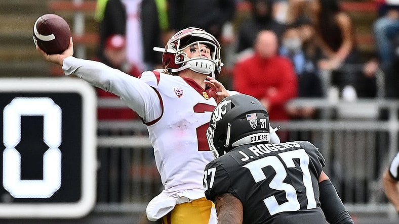 Sep 18, 2021; Pullman, Washington, USA; USC Trojans quarterback Jaxson Dart (2) throws the ball up before Washington State Cougars linebacker Justus Rogers (37) can get to him in the second half at Gesa Field at Martin Stadium. The Trojans won 45-14. Mandatory Credit: James Snook-USA TODAY Sports
