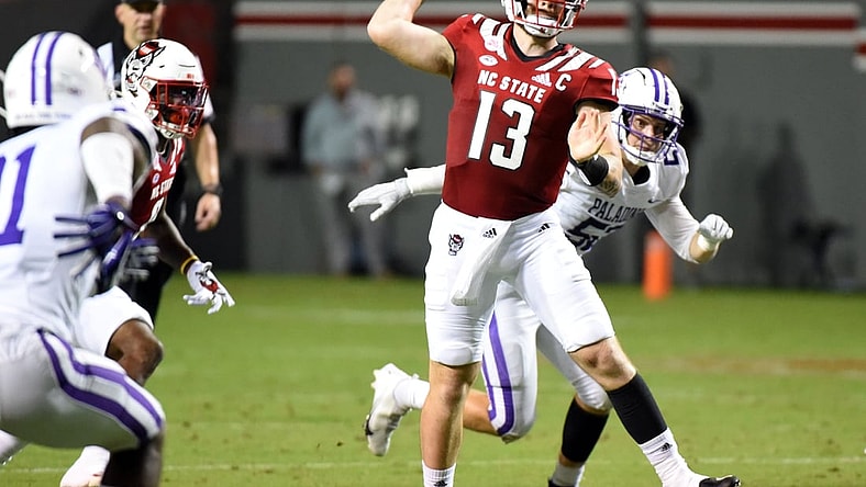 Sep 18, 2021; Raleigh, North Carolina, USA; North Carolina State Wolfpack quarterback Devin Leary (13) throws a pass during the first half against the Furman Paladins at Carter-Finley Stadium. Mandatory Credit: Rob Kinnan-USA TODAY Sports