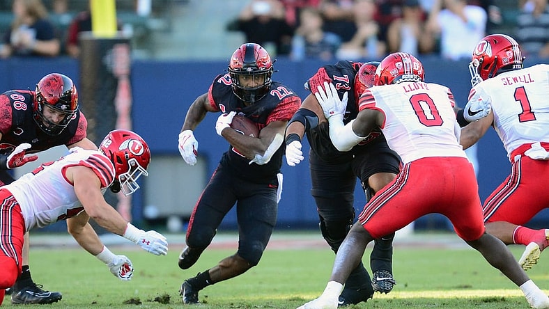 Sep 18, 2021; Carson, California, USA; San Diego State Aztecs running back Greg Bell (22) runs the ball against the Utah Utes during the first half at Dignity Health Sports Park. Mandatory Credit: Gary A. Vasquez-USA TODAY Sports