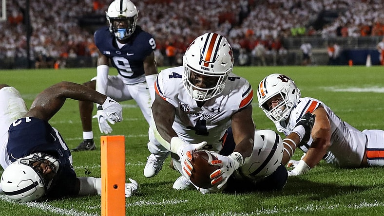 Sep 18, 2021; University Park, Pennsylvania, USA; Auburn Tigers running back Tank Bigsby (4) dives with the ball towards the end zone pylon for a touchdown during the third quarter against the Penn State Nittany Lions at Beaver Stadium. Penn State defeated Auburn 28-20. Mandatory Credit: Matthew OHaren-USA TODAY Sports