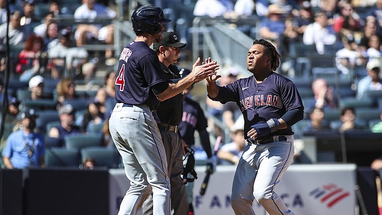 Sep 19, 2021; Bronx, New York, USA;  Cleveland Indians designated hitter Jose Ramirez (11) is greeted by center fielder Bradley Zimmer (4) after scoring in the third inning against the New York Yankees at Yankee Stadium. Mandatory Credit: Wendell Cruz-USA TODAY Sports