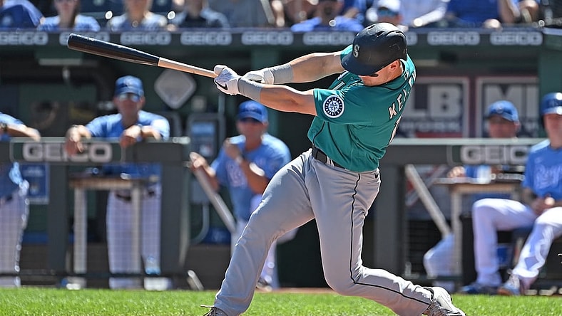 Sep 19, 2021; Kansas City, Missouri, USA;  Seattle Mariners center fielder Jarred Kelenic (10) hits a two run double during the first inning against the Kansas City Royals at Kauffman Stadium. Mandatory Credit: Peter Aiken-USA TODAY Sports