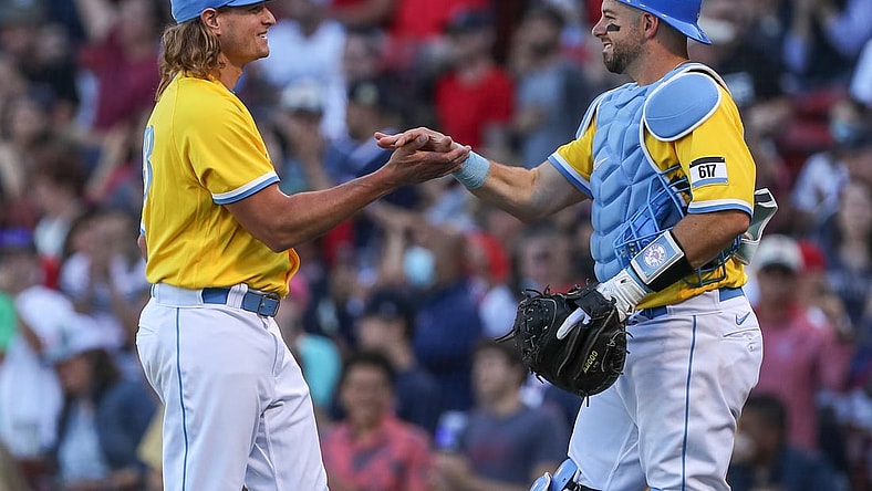 Sep 19, 2021; Boston, Massachusetts, USA; Boston Red Sox starting pitcher Garrett Richards (43) and Boston Red Sox catcher Kevin Plawecki (25) react after defeating the Baltimore Orioles at Fenway Park. Mandatory Credit: Paul Rutherford-USA TODAY Sports
