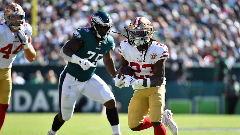 Sep 19, 2021; Philadelphia, Pennsylvania, USA; San Francisco 49ers running back JaMycal Hasty (23) runs past Philadelphia Eagles defensive end Tarron Jackson (75) during the fourth quarter at Lincoln Financial Field. Mandatory Credit: Eric Hartline-USA TODAY Sports