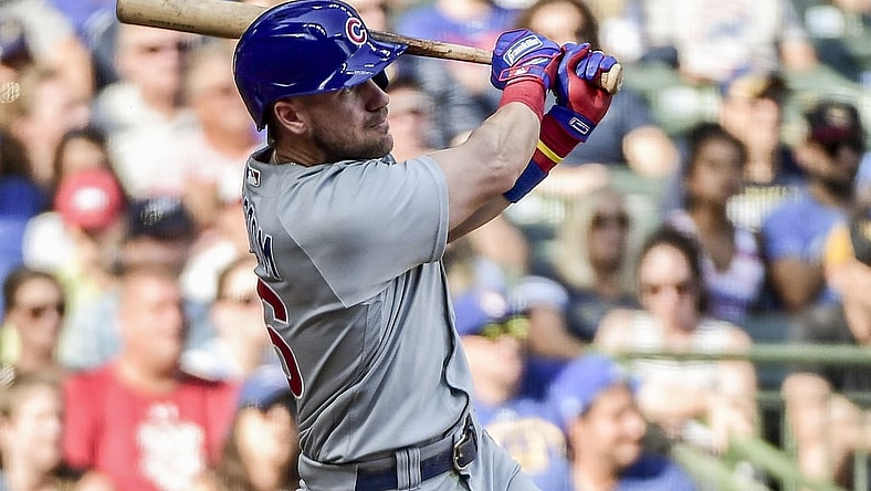 Sep 19, 2021; Milwaukee, Wisconsin, USA; Chicago Cubs third baseman Patrick Wisdom (16) hits a 3-run homer in the eighth inning against the Milwaukee Brewers  at American Family Field. Mandatory Credit: Benny Sieu-USA TODAY Sports