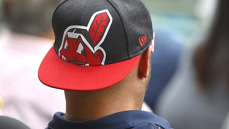Sep 20, 2021; Cleveland, Ohio, USA; A fans wears a cap featuring the logo of Chief Wahoo during a game between the Cleveland Indians and the Kansas City Royals at Progressive Field. Mandatory Credit: David Richard-USA TODAY Sports