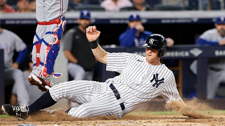 Sep 20, 2021; Bronx, New York, USA; New York Yankees second baseman DJ LeMahieu (26) scores on a RBI single by Aaron Judge (not pictured) against the Texas Rangers during the third inning at Yankee Stadium. Mandatory Credit: Vincent Carchietta-USA TODAY Sports