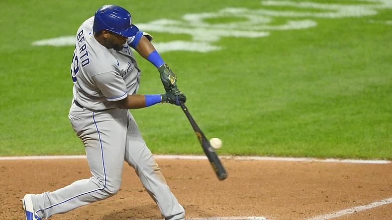 Sep 20, 2021; Cleveland, Ohio, USA; Kansas City Royals third baseman Hanser Alberto (49) doubles against the Cleveland Indians in the fourth inning at Progressive Field. Mandatory Credit: David Richard-USA TODAY Sports