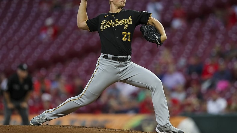 Sep 21, 2021; Cincinnati, Ohio, USA; Pittsburgh Pirates starting pitcher Mitch Keller (23) throws against the Cincinnati Reds in the first inning at Great American Ball Park. Mandatory Credit: Katie Stratman-USA TODAY Sports