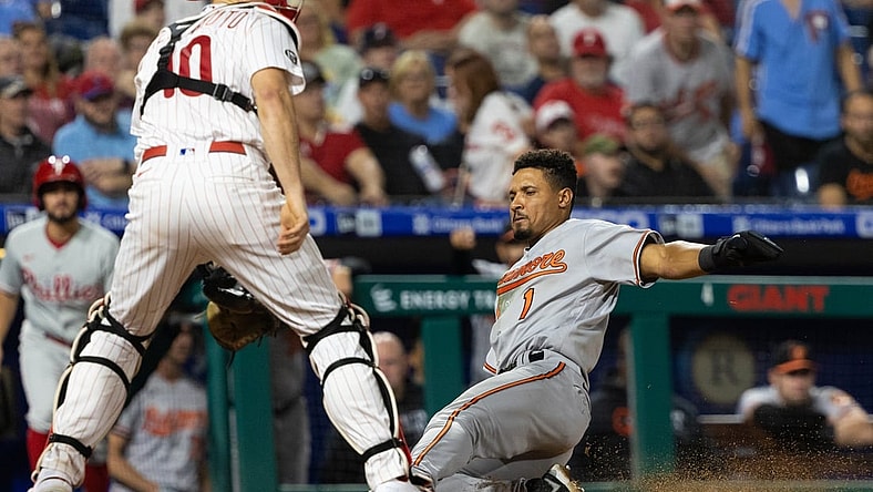 Sep 21, 2021; Philadelphia, Pennsylvania, USA; Baltimore Orioles shortstop Richie Martin (1) slides home safely past Philadelphia Phillies catcher J.T. Realmuto (10) during the fourth inning at Citizens Bank Park. Mandatory Credit: Bill Streicher-USA TODAY Sports