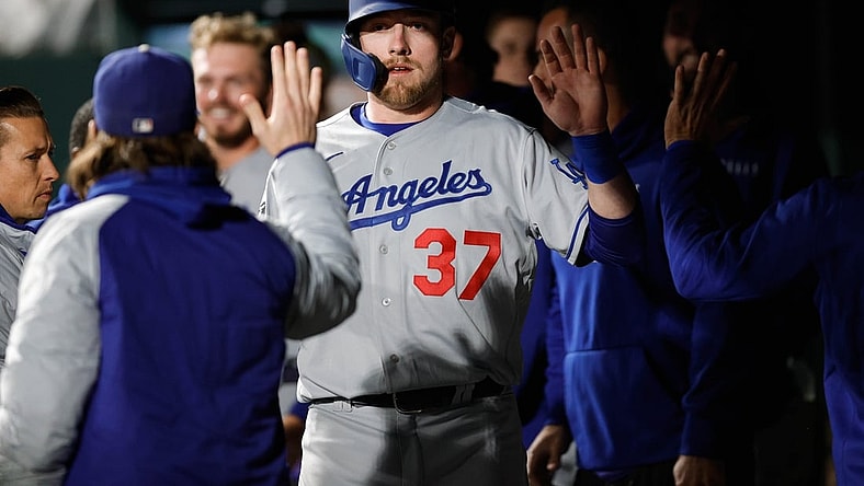Sep 21, 2021; Denver, Colorado, USA; Los Angeles Dodgers right fielder Luke Raley (37) celebrates in the dugout after scoring against the Colorado Rockies in the fifth inning at Coors Field. Mandatory Credit: Isaiah J. Downing-USA TODAY Sports