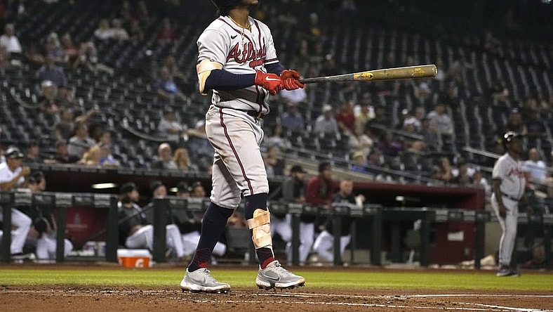 Sep 21, 2021; Phoenix, Arizona, USA; Atlanta Braves second baseman Ozzie Albies (1) hits a two run home run against the Arizona Diamondbacks in the third inning at Chase Field. Mandatory Credit: Rick Scuteri-USA TODAY Sports
