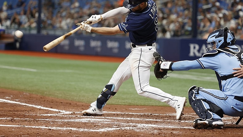 Sep 22, 2021; St. Petersburg, Florida, USA; Tampa Bay Rays second baseman Brandon Lowe (8) singles during the third inning against the Toronto Blue Jays at Tropicana Field. Mandatory Credit: Kim Klement-USA TODAY Sports