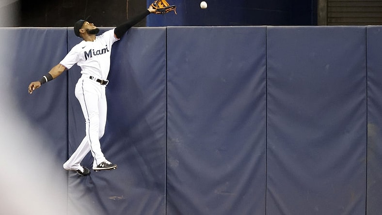Miami Marlins center fielder Bryan De La Cruz can't catch a home run by Washington Nationals left fielder Yadiel Hernandez during the second inning at loanDepot Park.