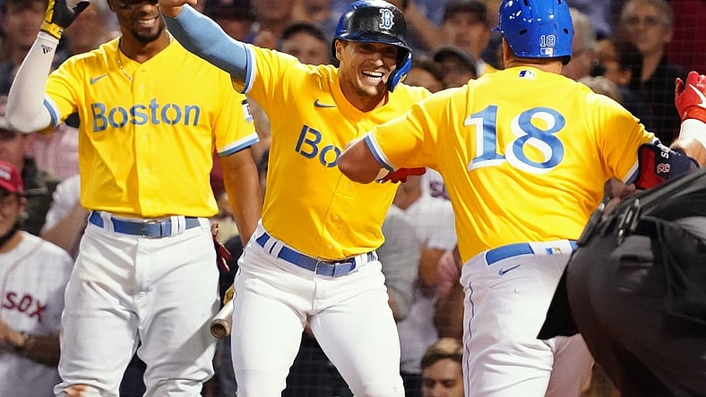 Sep 22, 2021; Boston, Massachusetts, USA; Boston Red Sox left fielder Kyle Schwarber (18) celebrates with teammates after hitting a three run home run against the New York Mets in the second inning at Fenway Park. Mandatory Credit: David Butler II-USA TODAY Sports