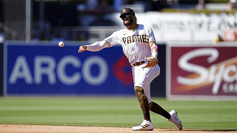 Sep 23, 2021; San Diego, California, USA;  San Diego Padres shortstop Fernando Tatis Jr. (23) throws out San Francisco Giants right fielder LaMonte Wade Jr. (not pictured) at first base during the fourth inning at Petco Park. Mandatory Credit: Ray Acevedo-USA TODAY Sports