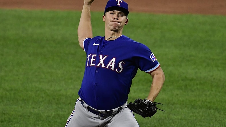 Sep 23, 2021; Baltimore, Maryland, USA; Texas Rangers starting pitcher Glenn Otto (49) delivers a third inning pitch against the Baltimore Orioles  at Oriole Park at Camden Yards. Mandatory Credit: Tommy Gilligan-USA TODAY Sports