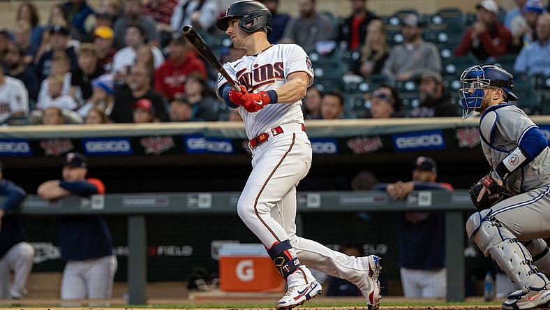 Sep 23, 2021; Minneapolis, Minnesota, USA; Minnesota Twins catcher Mitch Garver (8) hits a single during the first inning against the Toronto Blue Jays at Target Field. Mandatory Credit: Jordan Johnson-USA TODAY Sports