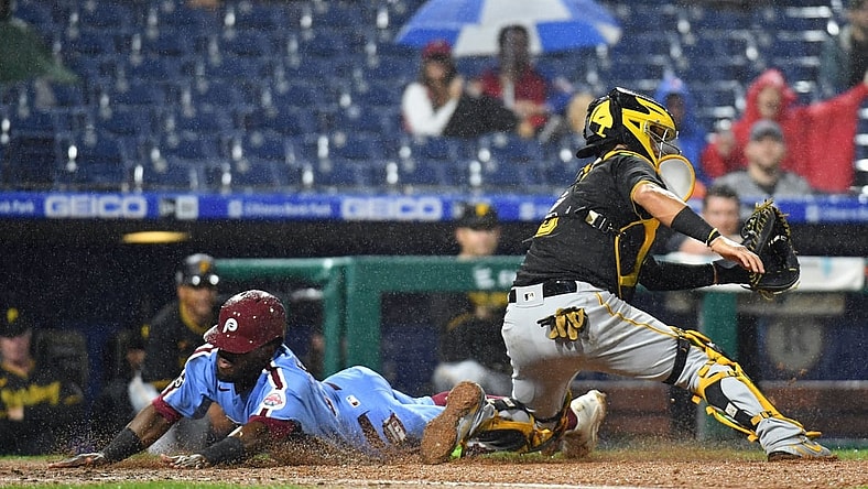 Sep 23, 2021; Philadelphia, Pennsylvania, USA; Philadelphia Phillies center fielder Odubel Herrera (37) slides safely into home past Pittsburgh Pirates catcher Michael Perez (5) during the third inning at Citizens Bank Park. Mandatory Credit: Eric Hartline-USA TODAY Sports