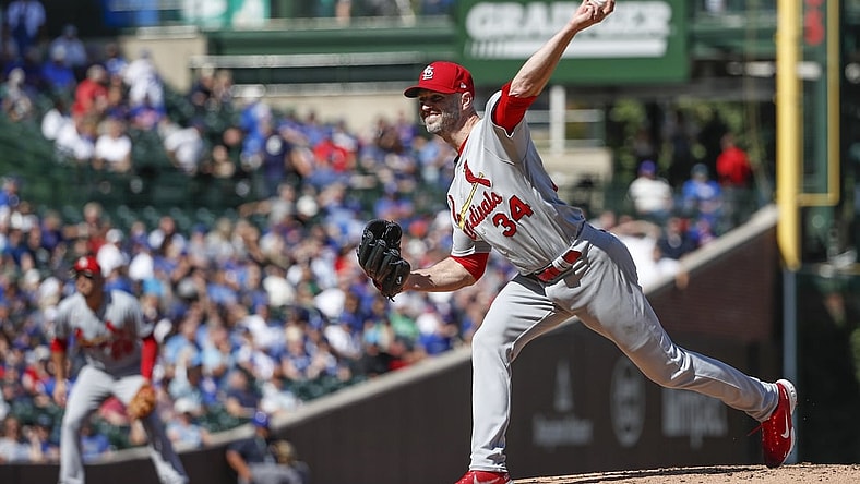 Sep 24, 2021; Chicago, Illinois, USA; St. Louis Cardinals starting pitcher J.A. Happ (34) delivers against the Chicago Cubs during the second inning of a Game 1 of the doubleheader at Wrigley Field. Mandatory Credit: Kamil Krzaczynski-USA TODAY Sports