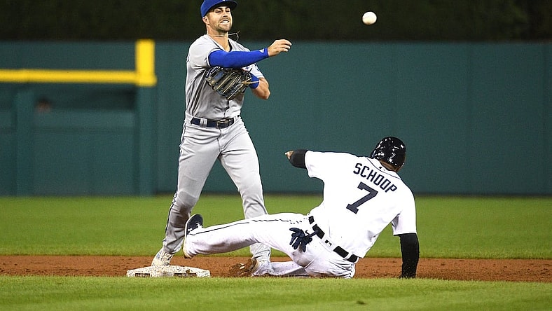Sep 24, 2021; Detroit, Michigan, USA; Kansas City Royals second baseman Whit Merrifield (15) forces Detroit Tigers first baseman Jonathan Schoop (7) out at second base and throws for a double play during the third inning at Comerica Park. Mandatory Credit: Tim Fuller-USA TODAY Sports