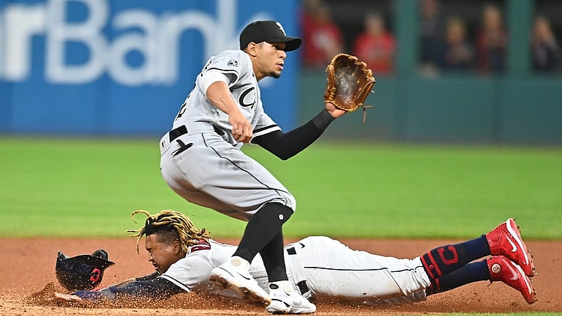 Sep 24, 2021; Cleveland, Ohio, USA; Cleveland Indians third baseman Jose Ramirez (11) steals second as Chicago White Sox second baseman Cesar Hernandez (12) waits for the throw during the fourth inning at Progressive Field. Mandatory Credit: Ken Blaze-USA TODAY Sports