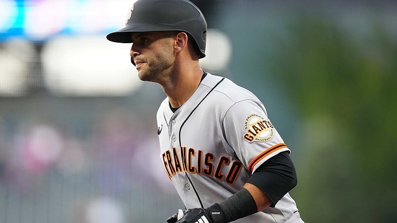 Sep 24, 2021; Denver, Colorado, USA; San Francisco Giants second baseman Tommy La Stella (18) scores a run in the first inning against the Colorado Rockies at Coors Field. Mandatory Credit: Ron Chenoy-USA TODAY Sports