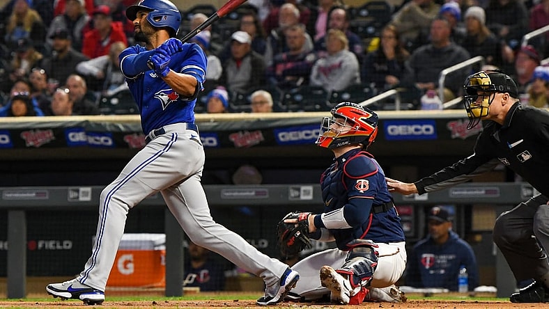 Sep 24, 2021; Minneapolis, Minnesota, USA; Toronto Blue Jays infielder Marcus Semien (10) hits a double off of Minnesota Twins starting pitcher Bailey Ober (82) during the first inning at Target Field. Mandatory Credit: Nick Wosika-USA TODAY Sports