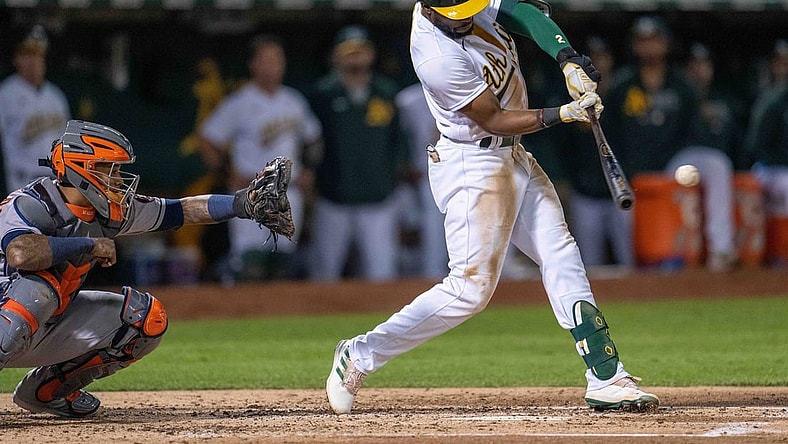 Sep 24, 2021; Oakland, California, USA;  Oakland Athletics center fielder Starling Marte (2) hits a RBI single during the third inning against the Houston Astros at RingCentral Coliseum. Mandatory Credit: Neville E. Guard-USA TODAY Sports
