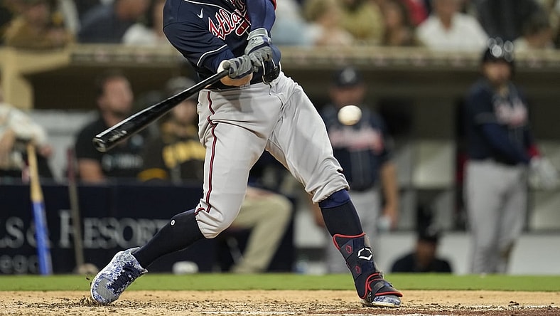 Sep 24, 2021; San Diego, California, USA;  Atlanta Braves left fielder Adam Duvall (14) hits an hits an RBI single against the San Diego Padres during the sixth inning at Petco Park. Mandatory Credit: Ray Acevedo-USA TODAY Sports