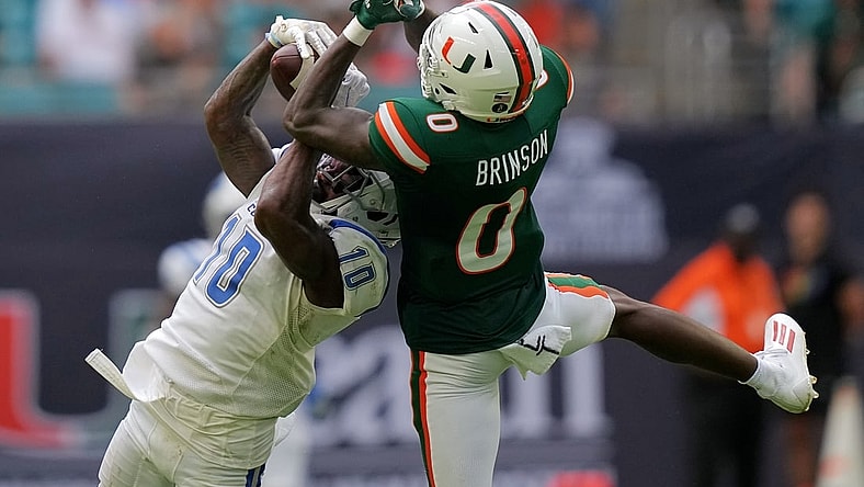 Sep 25, 2021; Miami Gardens, Florida, USA; Central Connecticut State Blue Devils cornerback Dexter Lawson Jr. (10) breaks up a pass intended for Miami Hurricanes wide receiver Romello Brinson (0) during the first half at Hard Rock Stadium. Mandatory Credit: Jasen Vinlove-USA TODAY Sports