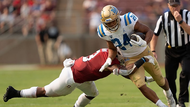 Sep 25, 2021; Stanford, California, USA;  Stanford Cardinal linebacker Levani Damuni (3) tackles UCLA Bruins running back Zach Charbonnet (24) during the first quarter at Stanford Stadium. Mandatory Credit: Stan Szeto-USA TODAY Sports