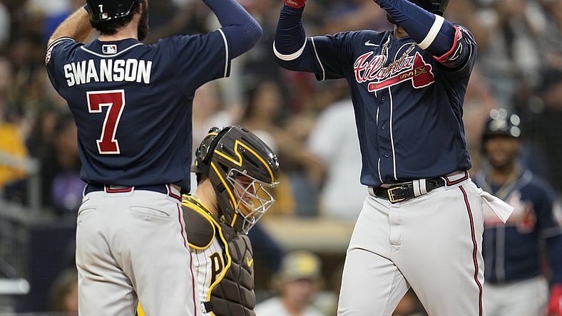 Sep 25, 2021; San Diego, California, USA;  Atlanta Braves right fielder Jorge Soler (12) celebrates his two run home run against the San Diego Padres with shortstop Dansby Swanson (left) during the sixth inning at Petco Park. Mandatory Credit: Ray Acevedo-USA TODAY Sports