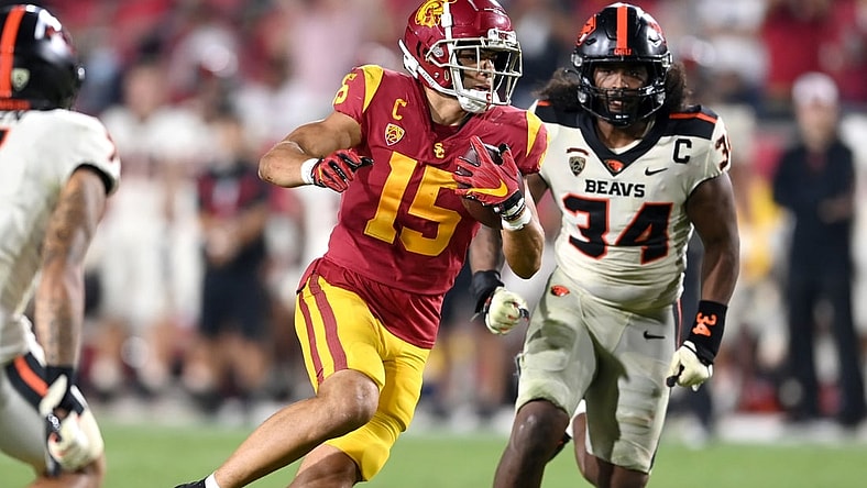 Sep 25, 2021; Los Angeles, California, USA; USC Trojans wide receiver Drake London (15) runs the ball after a complete pass in the second half of the game at United Airlines Field at Los Angeles Memorial Coliseum. Mandatory Credit: Jayne Kamin-Oncea-USA TODAY Sports