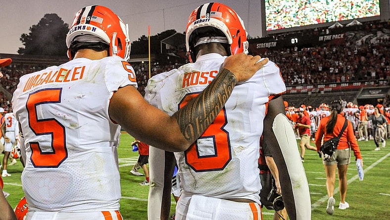 Clemson wide receiver Justyn Ross (8) is consoled by quarterback D.J. Uiagalelei (5) after the Tigers lost 27-21 in two overtimes on Saturday in Raleigh, N.C.

Ncaa Football Clemson At Nc State