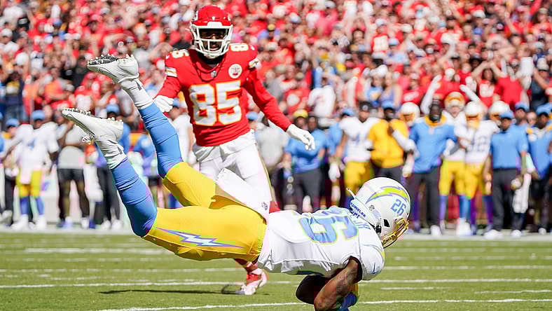 Sep 26, 2021; Kansas City, Missouri, USA; Los Angeles Chargers cornerback Asante Samuel Jr. (26) intercepts a pass intended for Kansas City Chiefs wide receiver Marcus Kemp (85) during the first half at GEHA Field at Arrowhead Stadium. Mandatory Credit: Denny Medley-USA TODAY Sports
