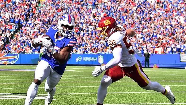 Sep 26, 2021; Orchard Park, New York, USA; Buffalo Bills running back Zack Moss (20) scores a touchdown beating Washington Football Team linebacker Cole Holcomb (55) to the end zone in the second quarter at Highmark Stadium. Mandatory Credit: Mark Konezny-USA TODAY Sports