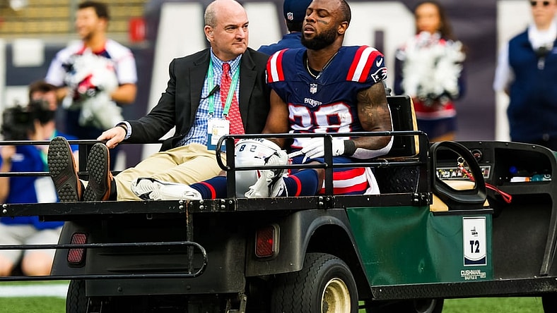 Sep 26, 2021; Foxborough, Massachusetts, USA; New England Patriots running back James White (28) is carried off the field after a running play against New Orleans Saints during the first half at Gillette Stadium. Mandatory Credit: Stephen Lew-USA TODAY Sports