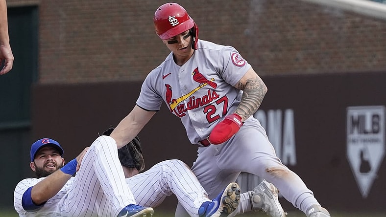 Sep 26, 2021; Chicago, Illinois, USA; St. Louis Cardinals left fielder Tyler O'Neill (27) steals second base as Chicago Cubs second baseman David Bote (13) makes a late tag during the sixth inning at Wrigley Field. Mandatory Credit: David Banks-USA TODAY Sports