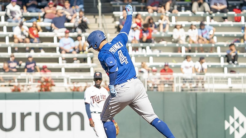 Sep 26, 2021; Minneapolis, Minnesota, USA; Toronto Blue Jays center fielder George Springer (4) hits a home run against Minnesota Twins starting pitcher Griffin Jax (83) at Target Field. Mandatory Credit: Matt Blewett-USA TODAY Sports