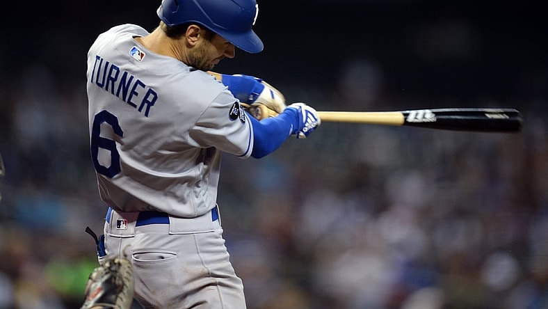 Sep 26, 2021; Phoenix, Arizona, USA; Los Angeles Dodgers shortstop Trea Turner (6) hits a double against the Arizona Diamondbacks during the third inning at Chase Field. Mandatory Credit: Joe Camporeale-USA TODAY Sports