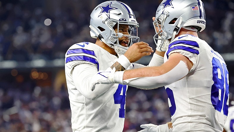 Sep 27, 2021; Arlington, Texas, USA; Dallas Cowboys quarterback Dak Prescott (4) celebrates with wide receiver CeeDee Lamb (88) after a touchdown pass against the Philadelphia Eagles during the first quarter at AT&T Stadium. Mandatory Credit: Kevin Jairaj-USA TODAY Sports