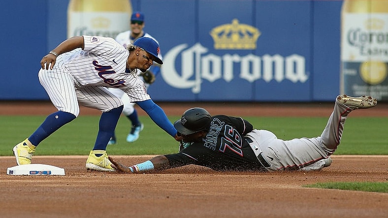 Sep 28, 2021; New York City, New York, USA; Miami Marlins right fielder Jesus Sanchez (76) is tagged out by New York Mets shortstop Francisco Lindor (12) attempting to steal second base during the first inning of game one of a doubleheader at Citi Field. Mandatory Credit: Andy Marlin-USA TODAY Sports